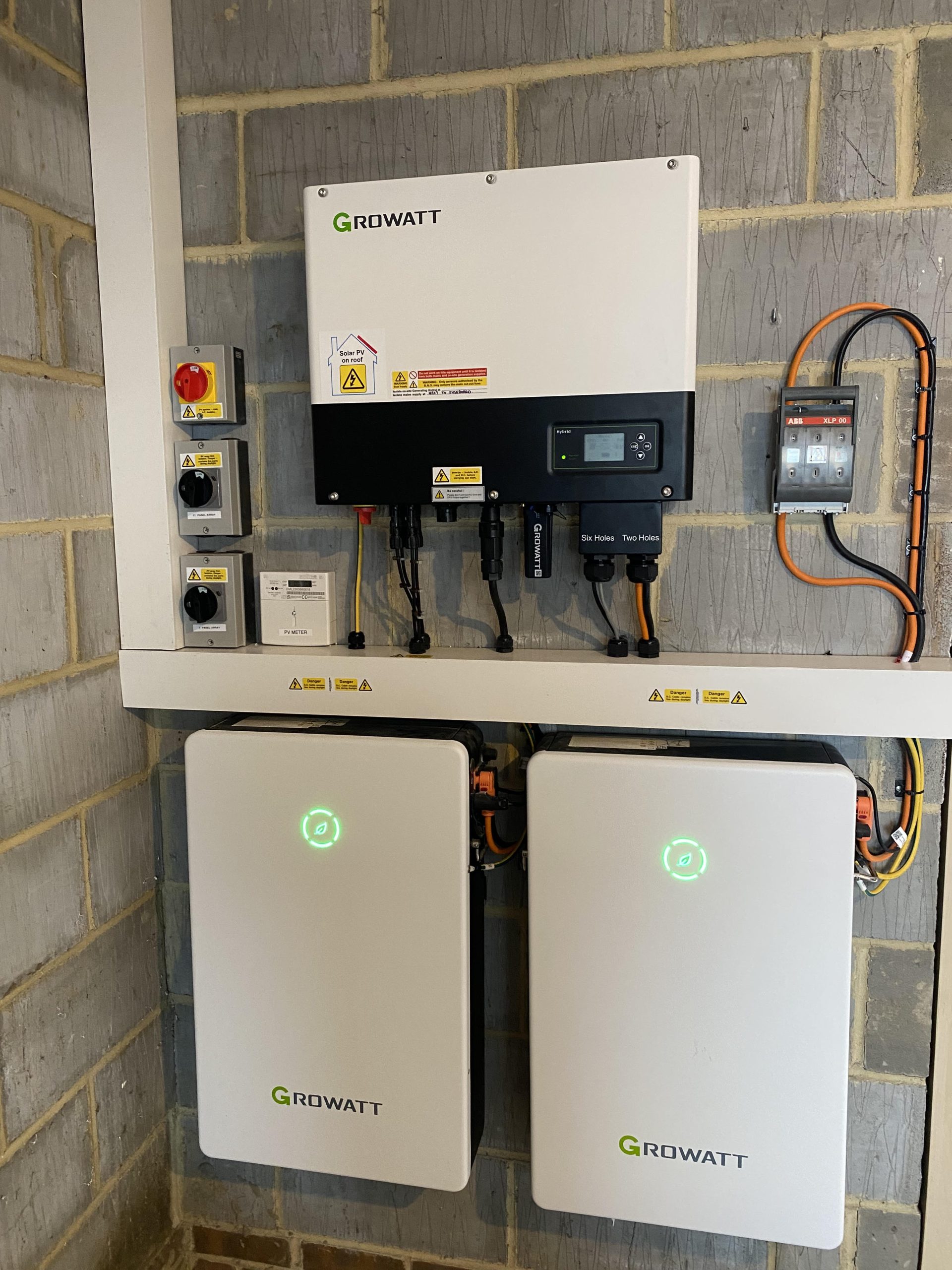 Engineer from AC Electricals (UK) Ltd connecting a home energy battery in Kent